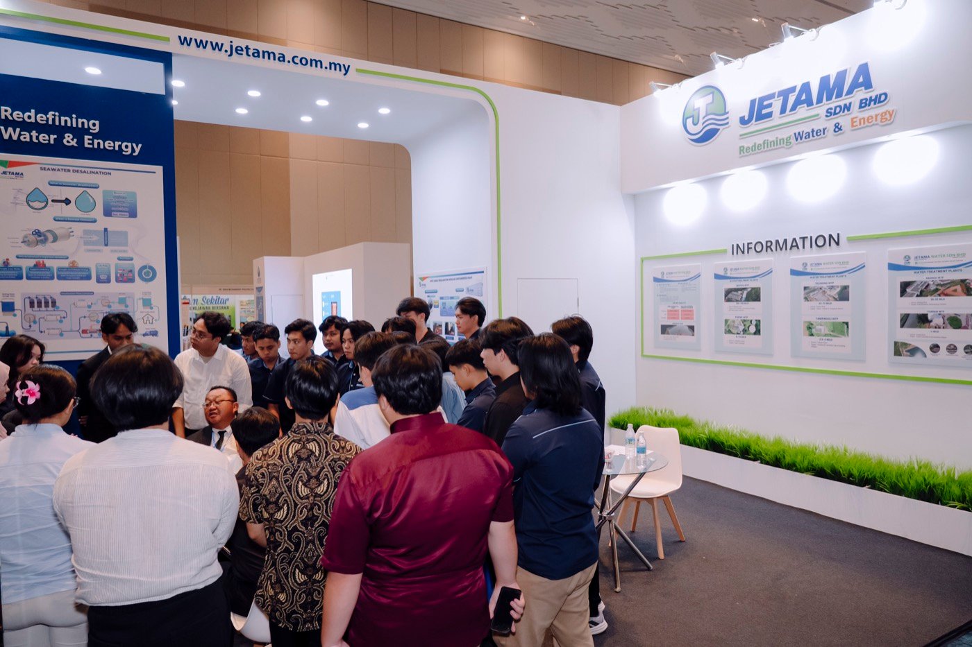Visitors learning about water systems at the Jetama exhibition booth during Plumbing Asia 2026